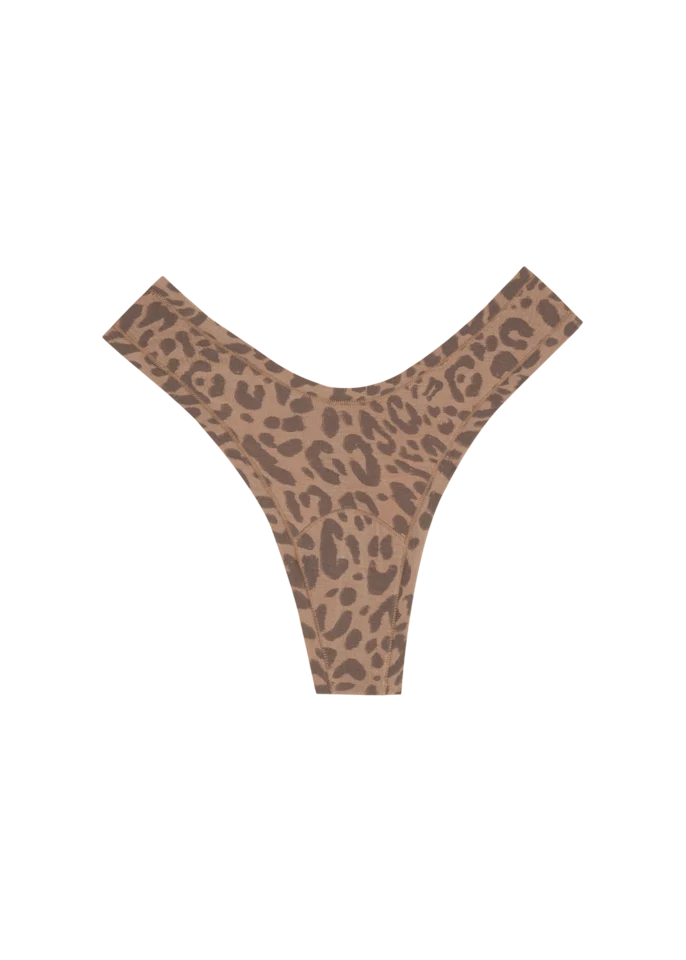 This Huha Dipped Thong is high-rise and sits comfortably at the hips and dips low in the front and back to create a flattering, high-leg V-shape. A wider hip band helps prevent digging or slipping, while the single-layer construction and low-pressure seams deliver an airy, barely-there feel.