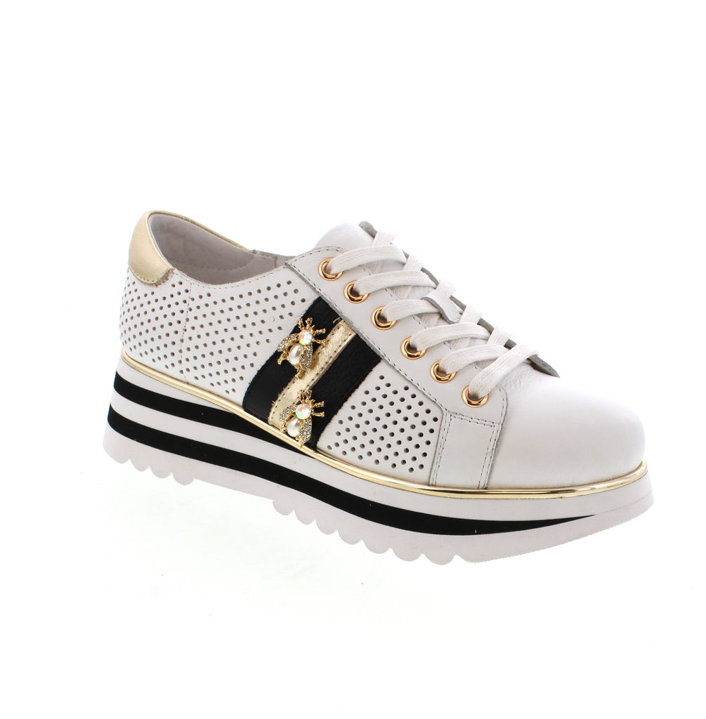 Introducing the Django & Juliette Eaglesy—where comfort meets cool. This leather sneaker pairs a round toe with a dependable lace-up for a fit that feels just right. Available in fresh white with vibrant multi-tone pops, it's the sneaker that works as hard as you do. The Eaglesy is your spring and summer go-to for effortless style.