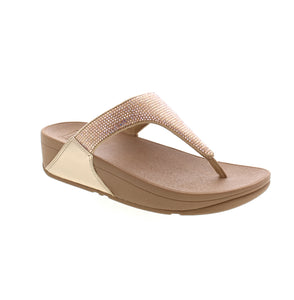 These timeless Lulu Crystal sandals feature a triangular vamp, softly padded uppers, and a pressure-diffusing Microwobbleboard™ midsole for ultimate comfort. With shimmering micro-'crystals' and pearlized faux-leather detailing, they are perfect for day-to-evening wear. Plus, they come with the APMA Seal of Acceptance for promoting good foot health.