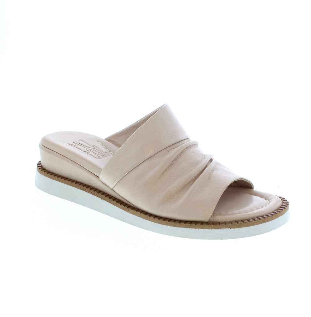 The Miz Mooz Erin slide sandal combines effortless style with everyday comfort. Crafted in soft latte leather with an open toe design, this casual essential features a supportive wedge heel (1-2 inches) and cushioned foam midsole.