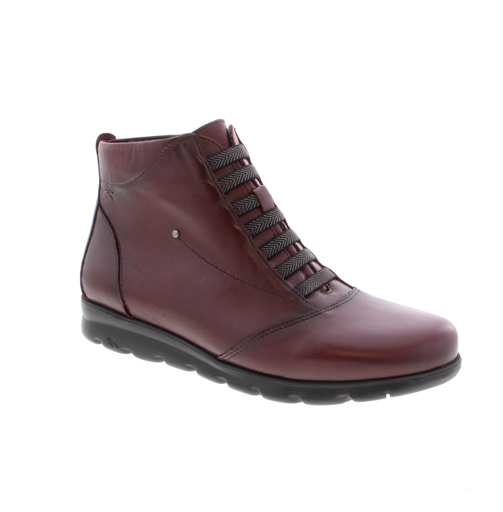 Elegant burgundy ankle bootie that combines comfort with timeless style. The Fluchos Susan F0356 features a supple leather upper, microfiber lining, and a supportive foam midsole for all-day wear. Crafted with a round toe, wedge heel under 1", and convenient side zip entry for easy on-and-off.