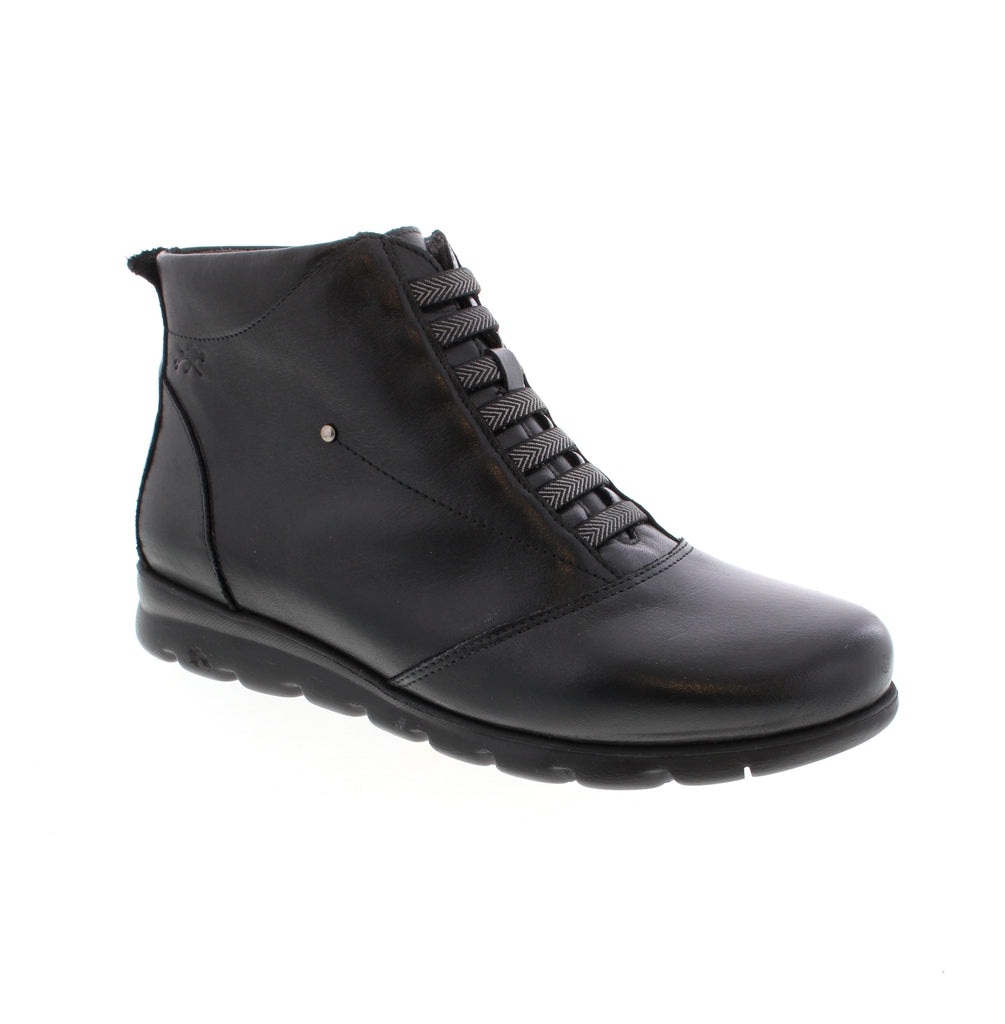 Fluchos Susan F0356 - Black Elegant black leather ankle bootie with a comfortable wedge heel and round toe design. Perfect for casual everyday wear with a polished, versatile look. Crafted with premium materials and thoughtful construction, this bootie combines style with all-day comfort. The side zip entry makes it easy to slip on, while the supportive foam midsole and microfiber footbed keep your feet cushioned throughout the day.