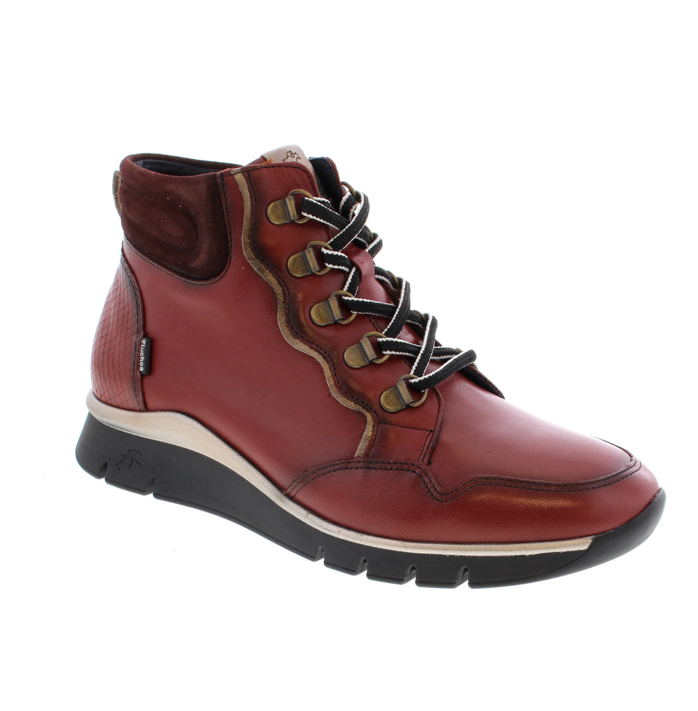 Fluchos Union F2073 in striking red leather brings European craftsmanship to your everyday rotation. This ankle boot combines comfort with style, featuring a supple leather upper, microfiber lining, and a supportive foam midsole that keeps you comfortable all day long.
