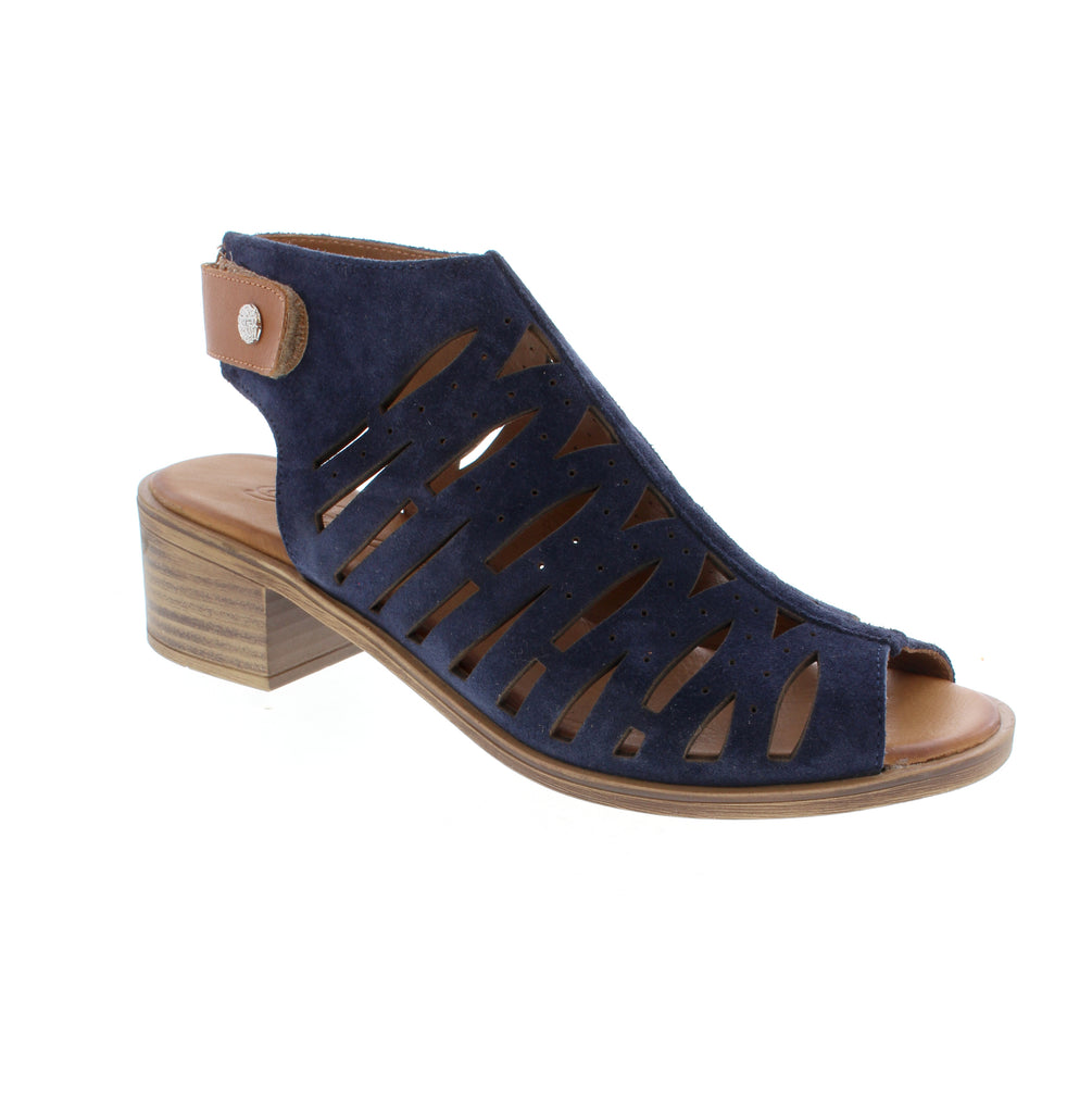 The Biza Flora navy multi sandal brings casual summer style with practical comfort features. Crafted from perforated suede with a suede lining, it offers breathability and softness underfoot. The leather footbed and foam midsole provide cushioning, while the stacked heel adds subtle lift. Velcro and back strap closures ensure a secure fit. Perfect for everyday warm-weather wear.