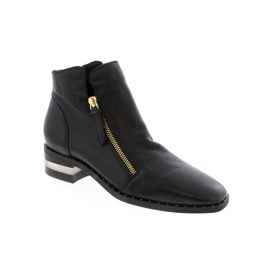 Django &amp; Juliet's Floriss-DJ bootie brings polished sophistication to your everyday rotation. This sleek black ankle boot features a leather upper with a stacked heel and chisel toe, designed for seamless transitions from office to evening. Leather upper and lining provide durability and comfort, while the man-made leather footbed and foam midsole deliver all-day support. The rubber outsole offers reliable traction, and double-side zip entry makes getting in and out effortless.