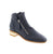 Django &amp; Juliet's Floriss-DJ bootie brings polished sophistication to your everyday rotation. This navy ankle boot features a leather upper with a stacked heel and chisel toe, designed for seamless transitions from office to weekend. Leather upper and lining provide durability and comfort, while the man-made leather footbed and foam midsole deliver all-day support. The rubber outsole offers reliable traction, and double side zip entry makes getting in and out effortless.