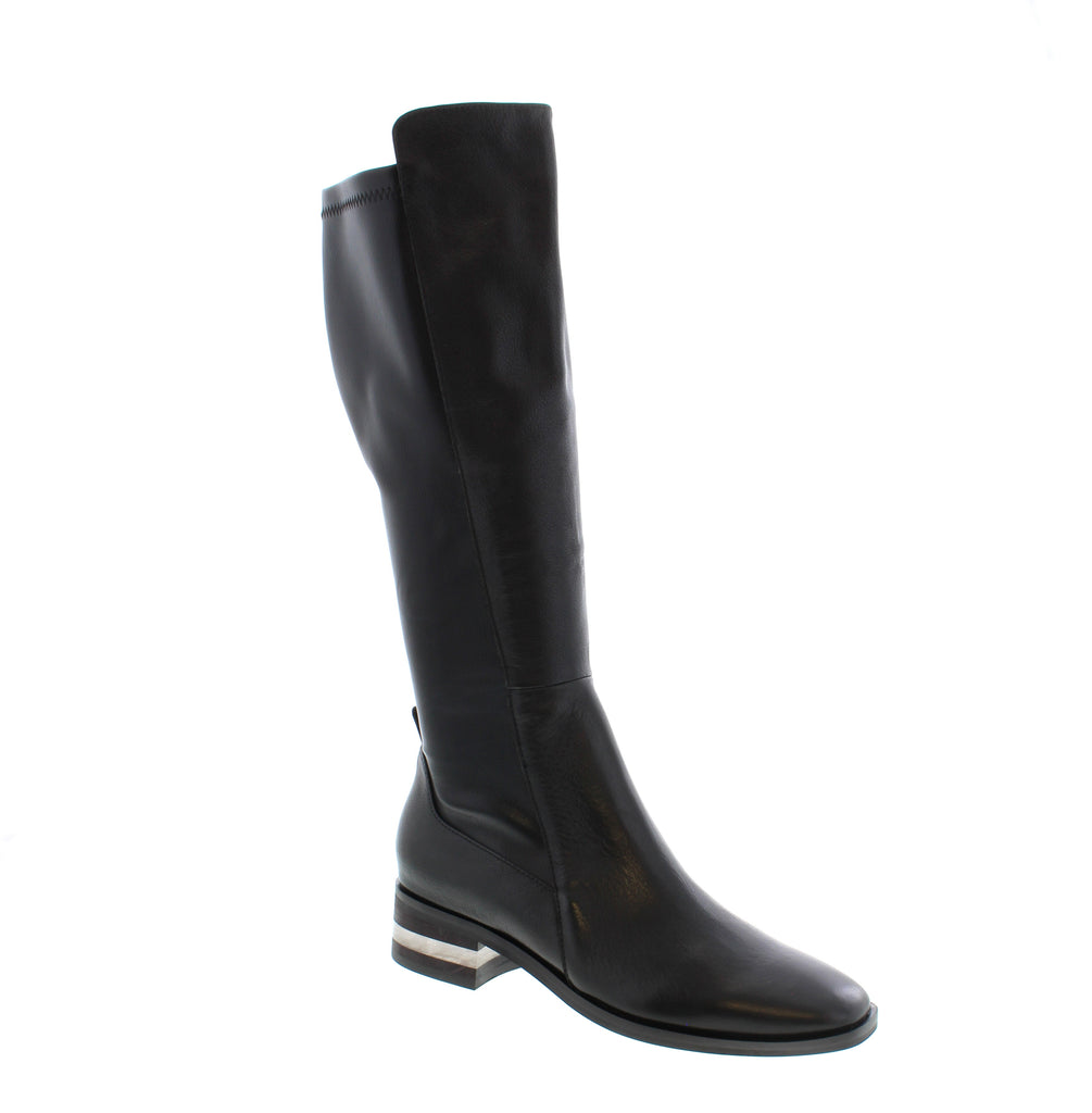 Elevate your style with the Django & Juliet Foxx leather knee-high boots. Designed with a sleek stretch panel across the calf, these boots offer a flattering, comfortable fit that moves with you. The modern silhouette pairs effortlessly with any outfit, making them a versatile choice for fashion-forward wardrobes. Experience both luxury and practicality in one elegant pair.