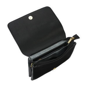 Ladies crossbody vegan leather bag, with fold over flap and magnetic closure.