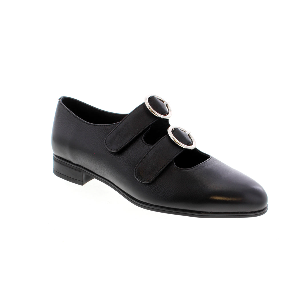 The Django & Juliette Gifth in black features a graceful almond toe and minimal block heel, designed for seamless transitions between professional and social settings. The velcro closure provides adjustable fit security. These versatile shoes complement both office attire and dress occasions with understated sophistication.