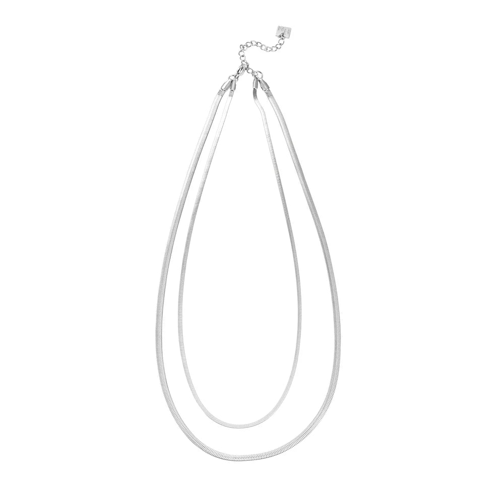 Elevate your everyday look with the Hackney Nine Ginta necklace in radiant white gold. This two-layer design features a striking snake-skin texture that catches the light beautifully. Crafted from premium white gold-infused alloys, it's a piece that combines timeless elegance with modern flair.