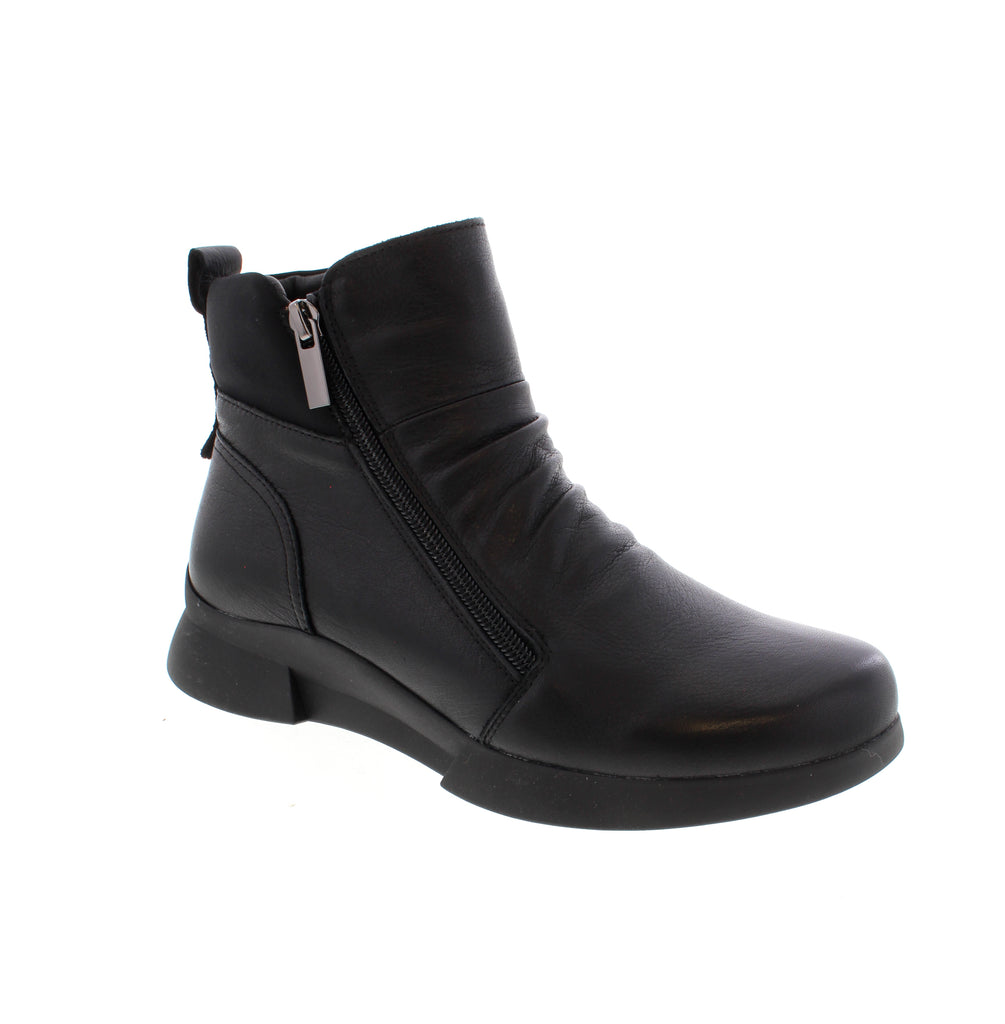 Roamers Hayden Black ankle boot combines sleek style with everyday comfort. This versatile boot features a leather upper with microfiber lining and footbed, paired with a foam midsole and rubber outsole for all-day wearability. Designed with a side zip entry for easy on-and-off, the Hayden fits true to size with an average width and instep. The flatform heel and round toe create a modern silhouette perfect for casual occasions.