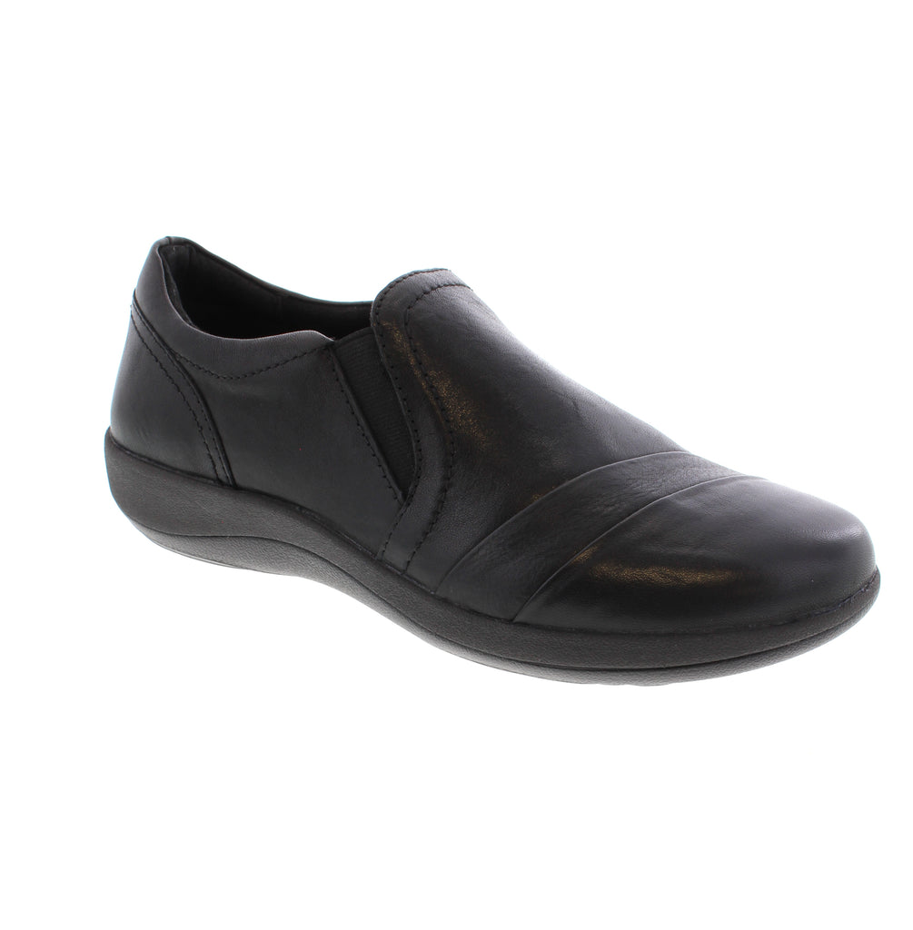 Experience unparalleled comfort with the Aetrex Helena. This sleek slip-on shoe features twin goring panels that make putting on and taking off effortless while adapting comfortably to your foot’s movement. Designed with built-in arch support, the Helena promotes better foot alignment and reduces daily foot fatigue. Its slip-resistant outsole enhances stability, making it ideal for both indoor and outdoor wear. 