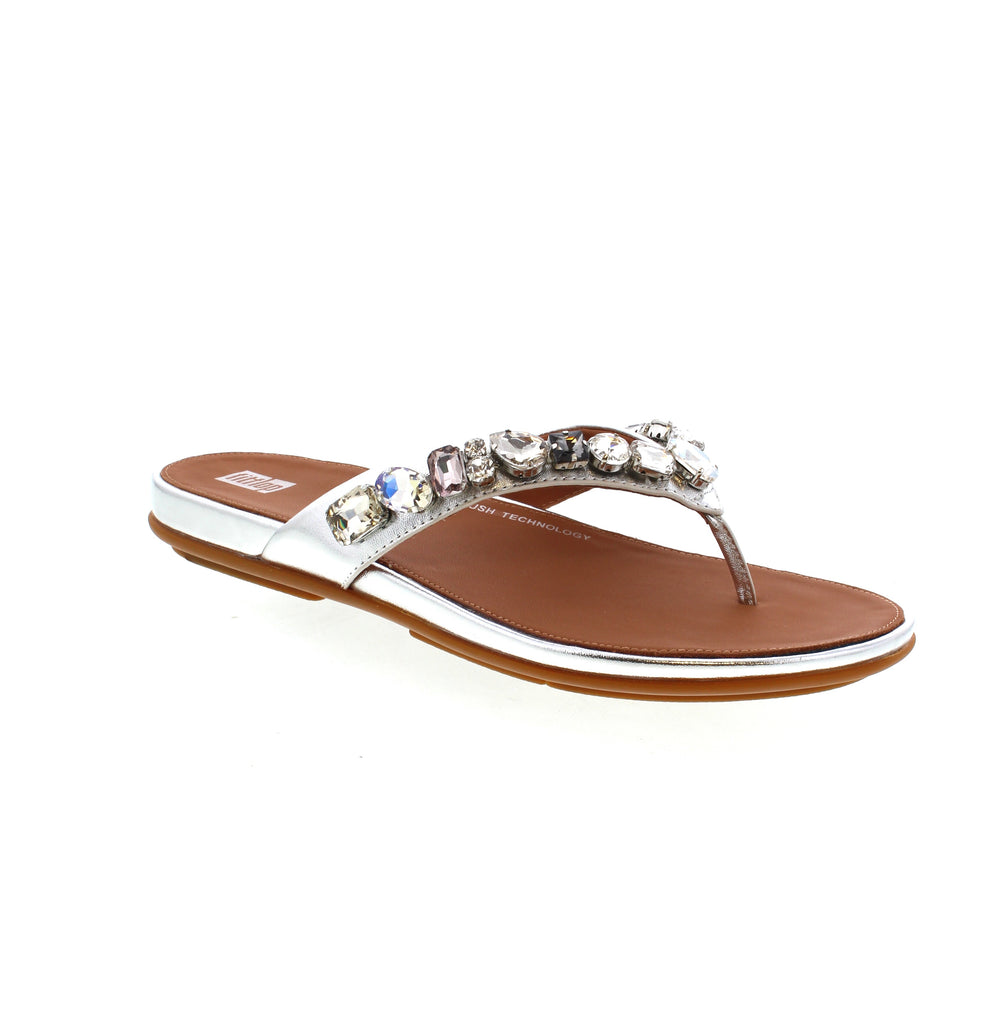 Experience extreme comfort and style with the Fitflop Gracie-Jewel Toe-Post Sandals. These bestselling bejewelled flip-flops feature contoured supportive footbeds and hidden cushioning for a sneaker-like feel. The metallic-leather straps are adorned with statement 'crystals' for a touch of glamour. Perfect for day to night wear.