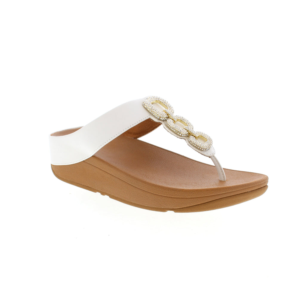 Step into ultimate comfort and style with the Fitflop Fino Crystal Chain Toe-Post Sandal. Made with supple leather and featuring a stunning chain detail, these sandals offer a minimalist design with clean lines. Thanks to the Microwobbleboard™ midsoles, you'll feel like you're walking on clouds. A classic bestseller, these sandals are a must-have for any wardrobe.