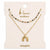 The K'lani Imagine necklace set celebrates creativity and hope through vibrant design. One necklace features colorful glass and gold beads, while the second showcases a gold rainbow charm on a detailed chain. Layer them together for inspired, limitless style.