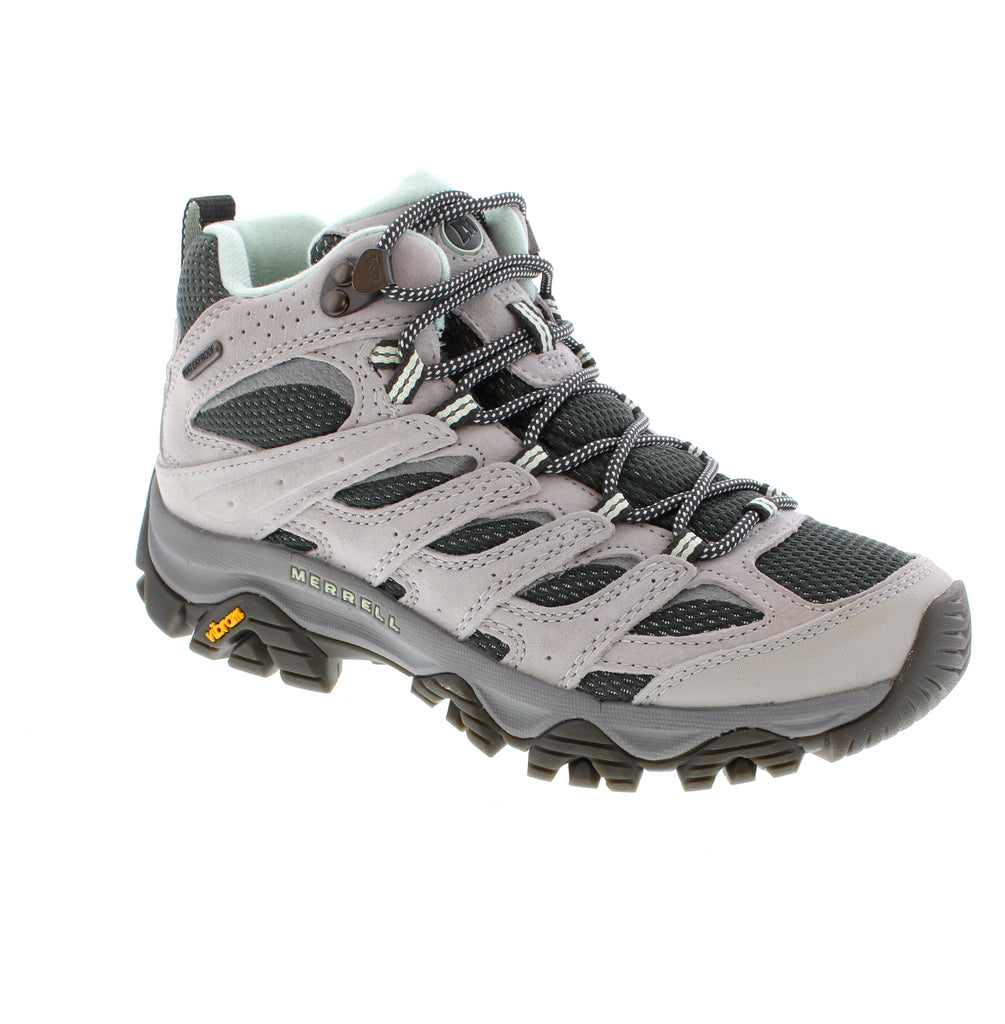 The Merrell Moab 3 Mid WP J00004923 is a waterproof women's hiking boot designed for year-round trail exploration. Built with suede and mesh upper construction, it keeps feet dry in wet conditions while allowing breathability. The mid-cut silhouette provides ankle support, while the removable microfiber footbed and light arch support accommodate custom orthotics. A shock-absorbent EVA/PU midsole and aggressive 5mm lug rubber outsole deliver comfort and traction on challenging terrain.