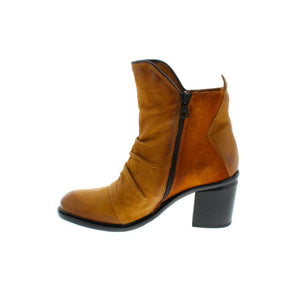 The Miz Mooz Jackey ankle boots are the perfect blend of style and comfort. The buttery soft leather and suede upper is complemented by ruching detailing and a unique cut. Cushioned insoles and rubber soles provide all-day comfort with an effortless fit. A must-have for any fashion-forward wardrobe.