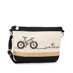 The Jak's Classique Solano shoulder bag is the perfect blend of charm and functionality. Its delightful bicycle design will win you over, while its compact design expertly accommodates all your essentials.