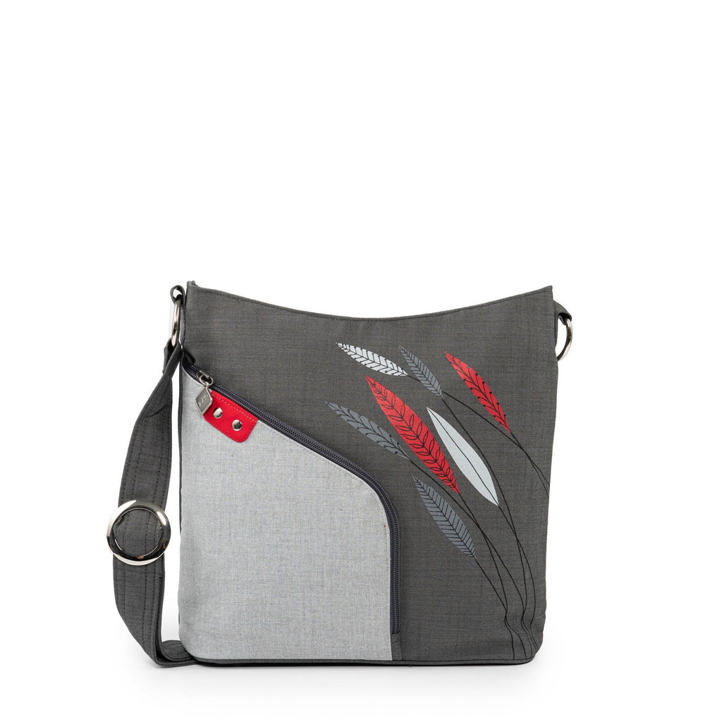 Expertly designed for both style and functionality, Jak's Actuelle Tourbillon shoulder bag boasts a spacious format and multiple pockets, including a convenient front pocket with an organizer. Adorned with beautifully painted flowers, this bag is perfect for keeping all your essentials organized in one place.