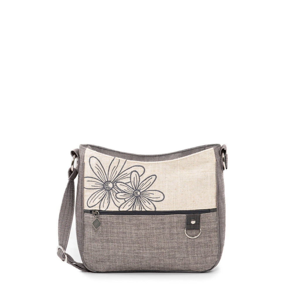 Effortlessly stylish and functional, the Jak's Actuelle Burga shoulder bag features charming embroidery and a mix of materials. With its integrated organizer, it offers both safety and practicality for daily use. Elevate your look with this must-have bag.
