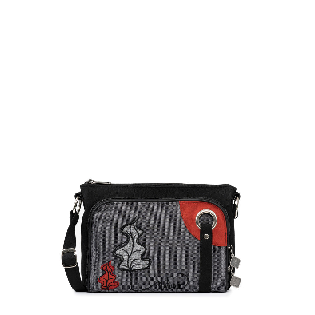 This elegant shoulder bag from Jak's Tonique Filou is adorned with exquisite natural embroidery, exuding a timeless charm. A front organizer pocket conveniently stores cards, change, and personal items. Despite its compact size, this bag can easily accommodate all your essentials. Upgrade your style with this functional and fashionable choice.
