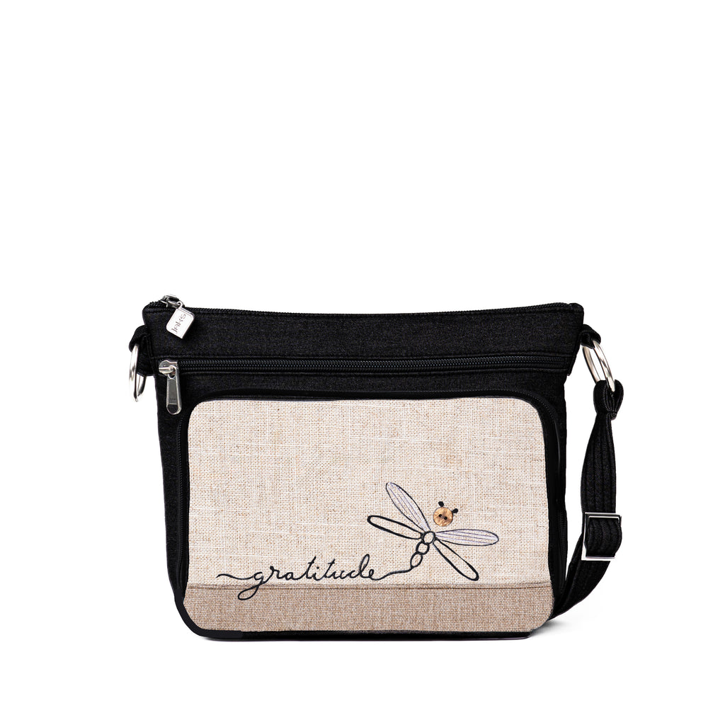 Stay organized in style with the Jak's Aruba Classique cross body bag. This bag features a top zip main compartment, side zip pocket and a convenient organizer for storing cards, cash and your phone. Complete with an adjustable shoulder strap and embroidered "gratitude" dragonfly.
