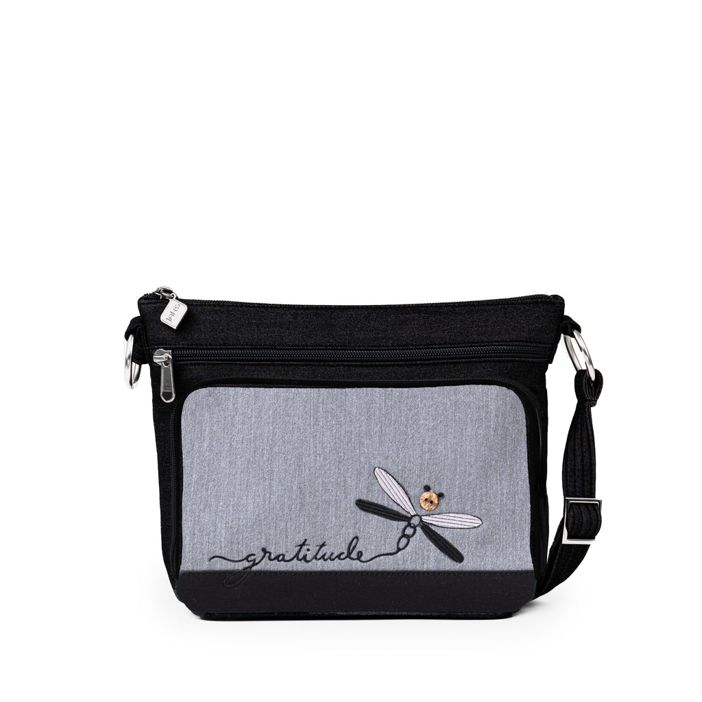 Stay organized in style with the Jak's Aruba Classique cross body bag. This bag features a top zip main compartment, side zip pocket and a convenient organizer for storing cards, cash and your phone. Complete with an adjustable shoulder strap and embroidered "gratitude" dragonfly.