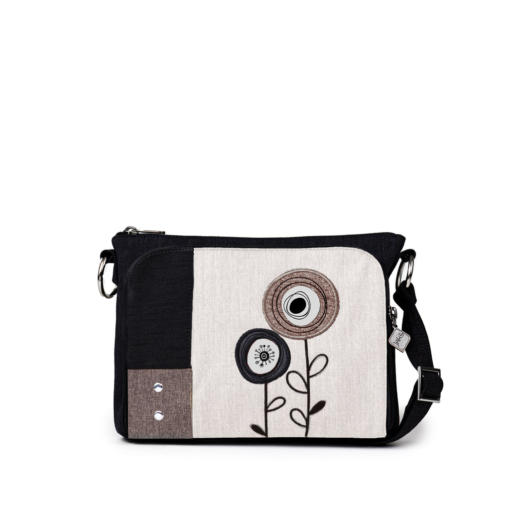 The Jak's Capri Classique cross body bag features a top zip main compartment and a front zip-around organizer for storing cards, cash and your phone. The embroidered detailing adds style to keeping your essentials organized.