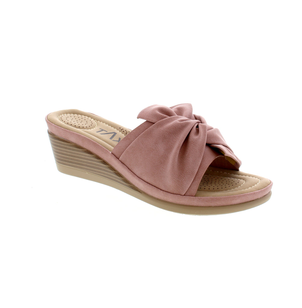 Experience comfort and style with the Janice-05 wedge Sandal. Featuring soft sock padding and a flexible outsole, these sandals are perfect for all-day wear. The beautiful tie detail adds a touch of fashion-forward design.