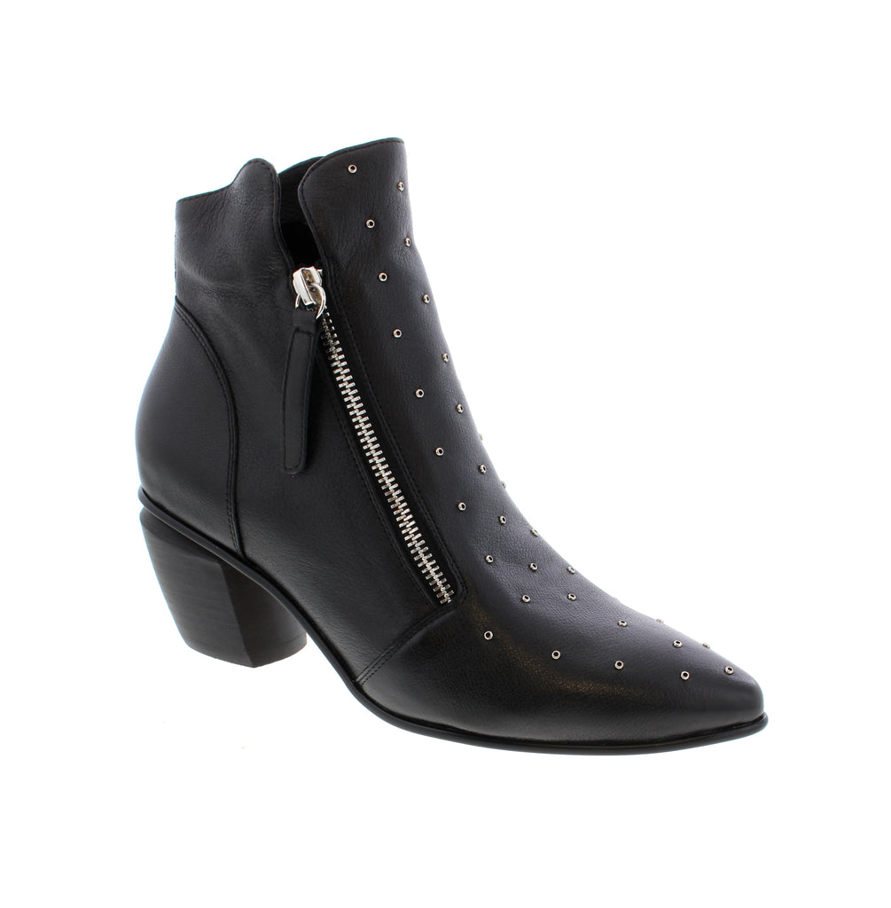 Elevate your everyday style with the Django &amp; Juliet Jazzya-DJ, a sleek black studded ankle bootie that seamlessly transitions from office to casual settings. Crafted with a premium leather upper and lined for comfort, this pointed-toe bootie features a stacked heel and side zip entry for effortless wear.