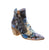 &nbsp;

The Django &amp; Juliet Jazzy in Blue Metal Floral combines timeless elegance with a modern edge. Designed with a feminine silhouette that gently contours your ankles, this versatile shoe elevates any daytime look with its softly pointed toe. The sloped stacked heel offers subtle height and comfort, perfect for all-day wear. A standout feature is the stylish twin zip fastening, adding both practicality and a unique, contemporary flair. 