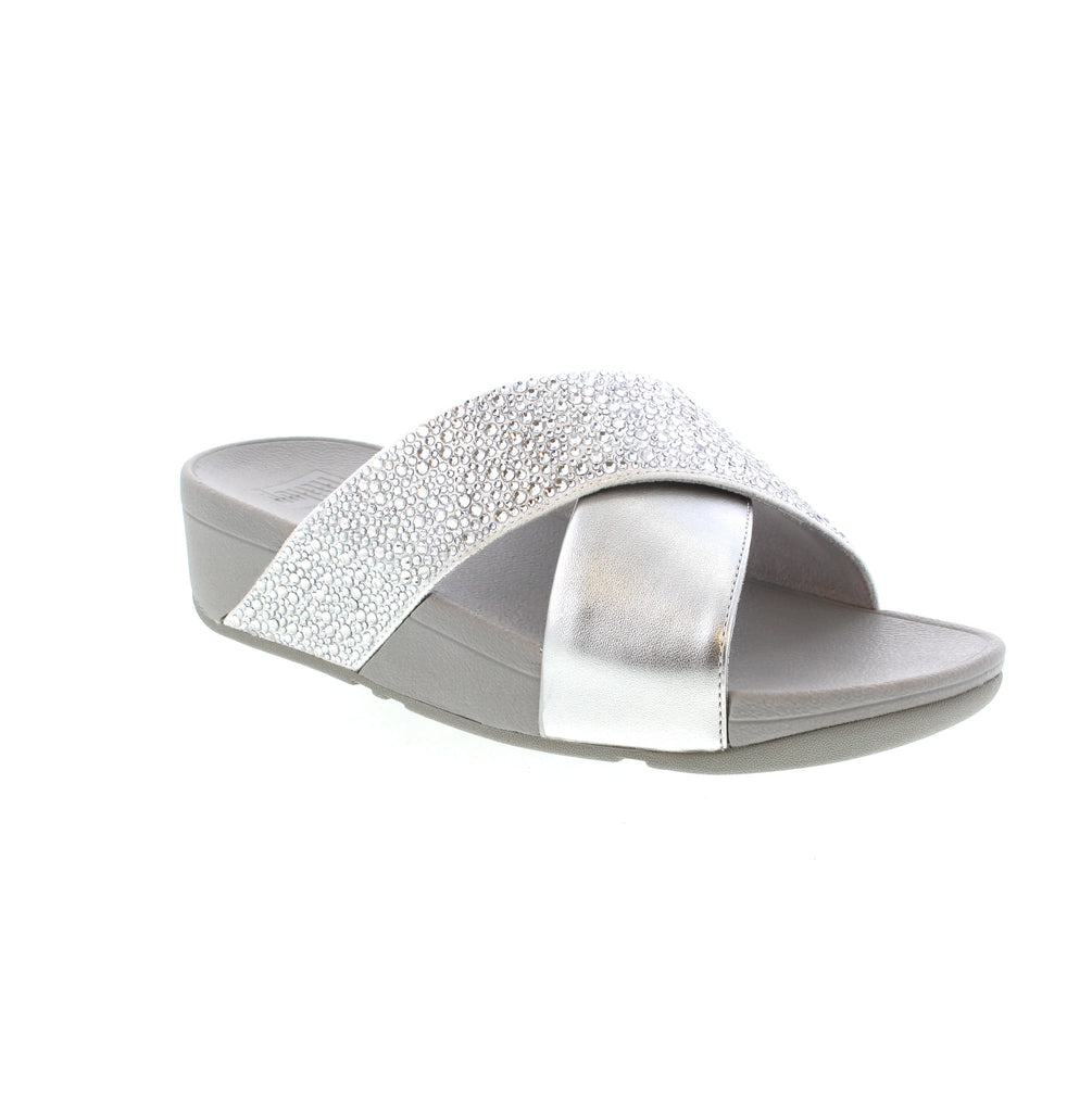 The Fitflop Lulu Slide JE2 is a stunning and versatile sandal that offers style, comfort, and a customizable fit. Made with shimmering metallic leather and featuring touch straps, these minimalist-chic shoes are perfect for any occasion. With unbeatable comfort and pressure-diffusing Microwobbleboard™ midsoles, these slides are a practical and polished choice for everyday wear.