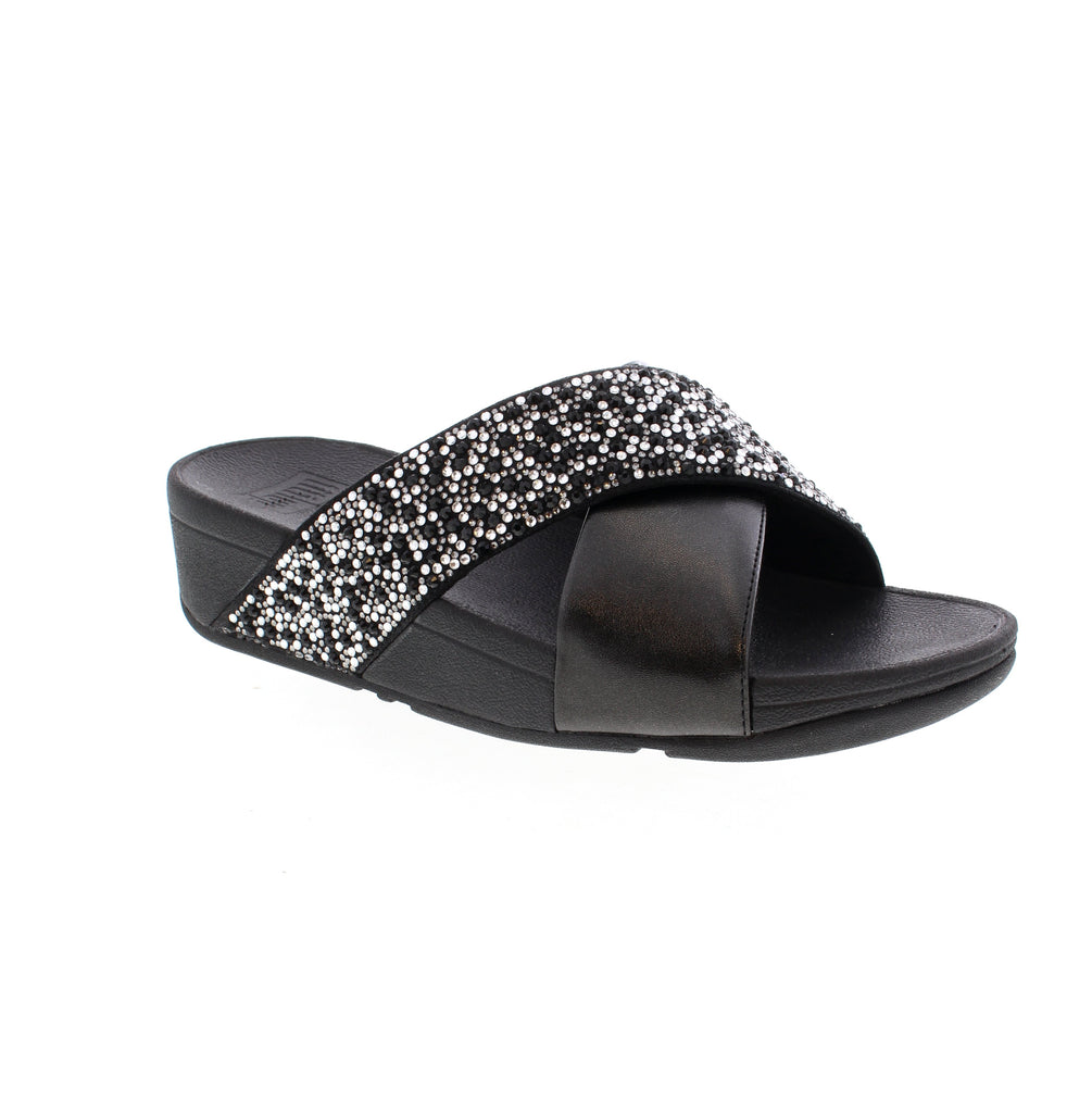 The Fitflop Lulu Slide JE2 is a stunning and versatile sandal that offers style, comfort, and a customizable fit. Made with shimmering metallic leather and featuring touch straps, these minimalist-chic shoes are perfect for any occasion. With unbeatable comfort and pressure-diffusing Microwobbleboard™ midsoles, these slides are a practical and polished choice for everyday wear.