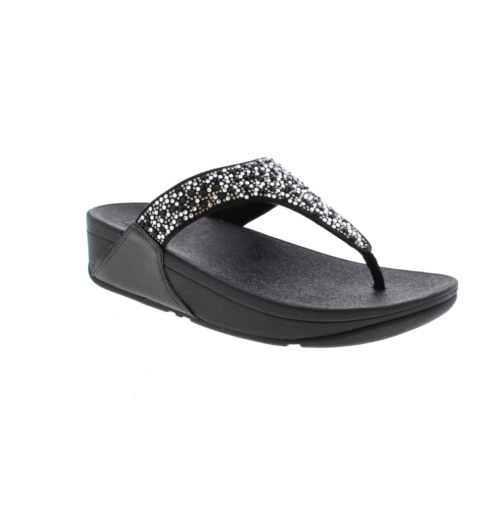 Experience style, comfort with the Fitflop Lulu Toe-Post JE3. These shimmering silver sandals feature metallic straps for a minimalist-chic look. With unbeatable comfort and pressure-diffusing Microwobbleboard™ midsoles, these sandals are perfect for any occasion.