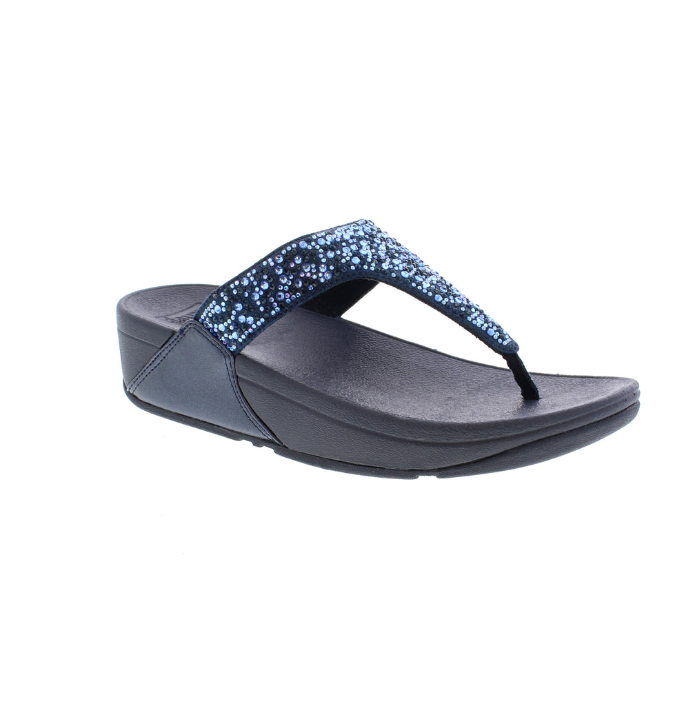 Experience style, comfort with the Fitflop Lulu Toe-Post JE3. These shimmering silver sandals feature metallic straps for a minimalist-chic look. With unbeatable comfort and pressure-diffusing Microwobbleboard™ midsoles, these sandals are perfect for any occasion.