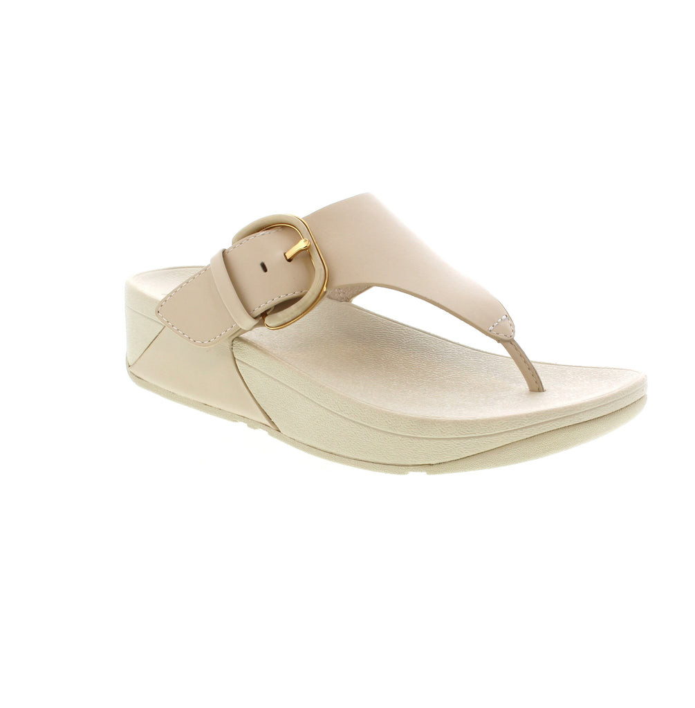 Expertly crafted from luxurious leather, the Fitflop Lulu Buckle Toe-Post Sandal in Beige boasts a sleek, minimalist design with classic triangular straps. Coupled with the incredibly comfortable Microwobbleboard™ midsoles and secure buckle closure, these sandals have been likened to walking on a cloud.