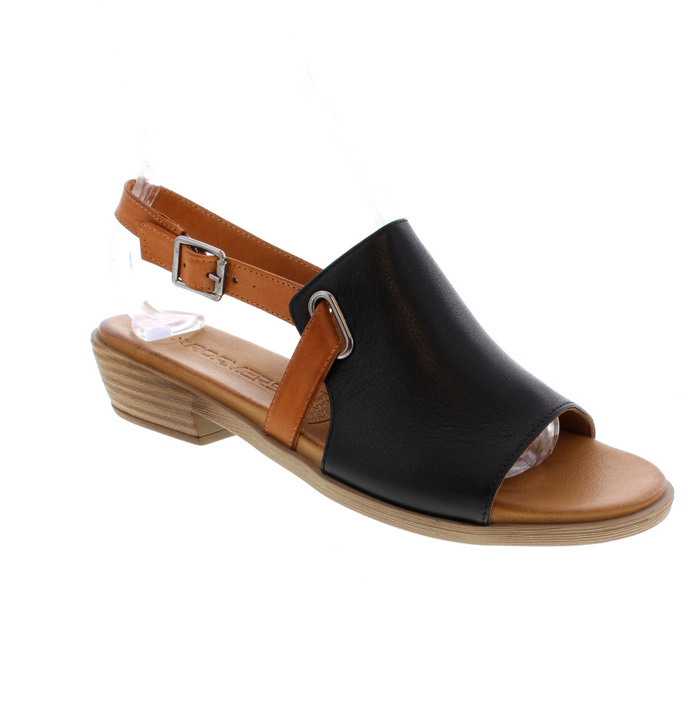 The Roamers Mae sandal in grey multi combines versatile style with practical comfort. Built with a leather upper, lining, and footbed, this open-toe design features a secure buckle closure and foam midsole for cushioned support. The stacked heel and round toe shape offer a flattering silhouette perfect for casual summer outings.