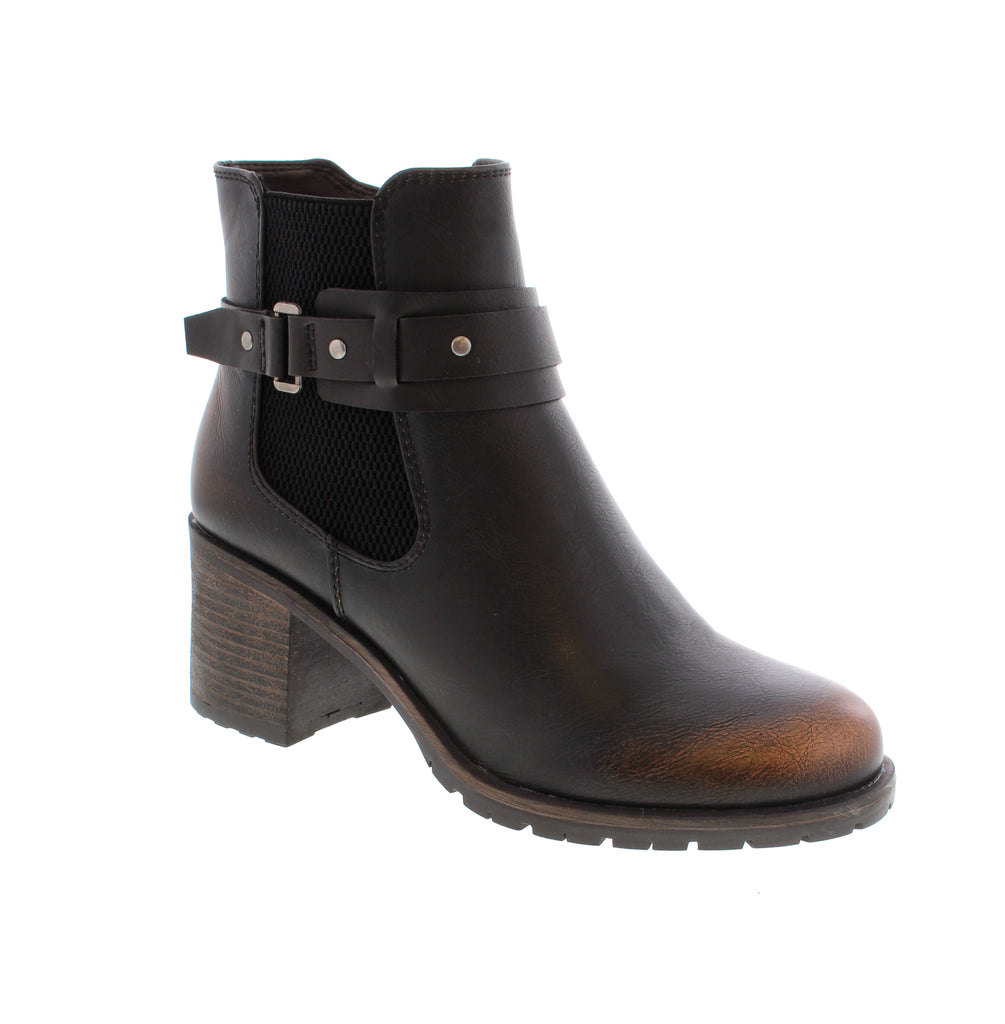 The Taxi Kathy-01T booties in Brown showcase a refined design featuring an elasticized upper for optimal comfort. A convenient side zipper enhances ease of wear, while the rounded toe provides a balanced silhouette. The block heel ensures stable support, making these booties a versatile choice for both professional and casual settings.