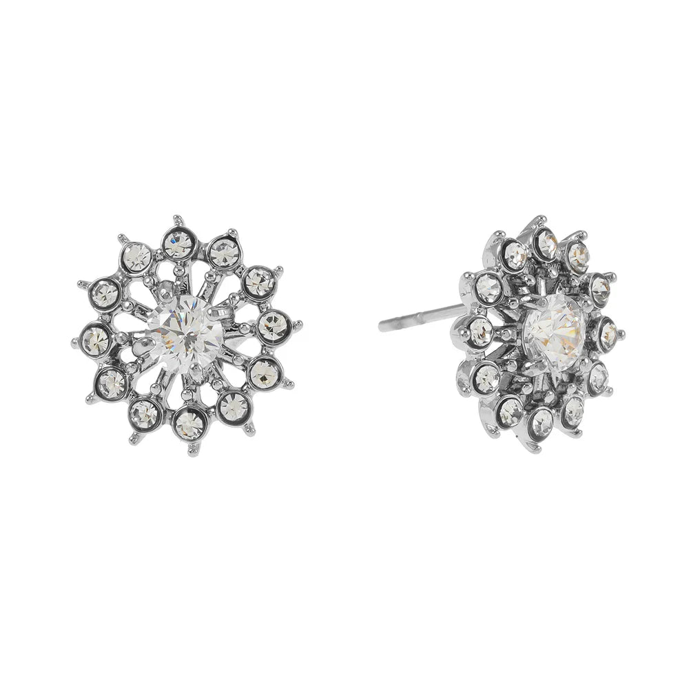 Hackney Nine Kerala Silver Stud Earrings feature a striking star design adorned with sparkling AAA-grade zirconia gemstones. A larger centerpiece stone anchors the design, creating a brilliant halo effect that catches the light beautifully. Perfect for special occasions or everyday elegance, these earrings deliver timeless sophistication with eye-catching sparkle.