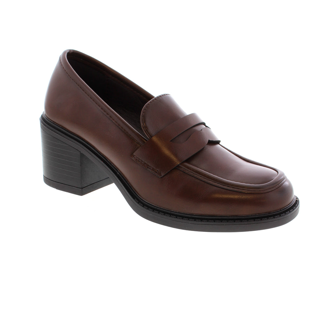 Taxi Kylee - Brown is a versatile slip-on pump designed for the modern professional. Featuring a man-made leather upper with a comfortable foam midsole and rubber outsole, this shoe delivers everyday wearability with polished style. The block heel sits at 1–2" for subtle lift, while the round toe and average fit across length, width, and instep make it easy to wear all day. Perfect for business professional settings and office environments, the Kylee transitions seamlessly from desk to meeting room.