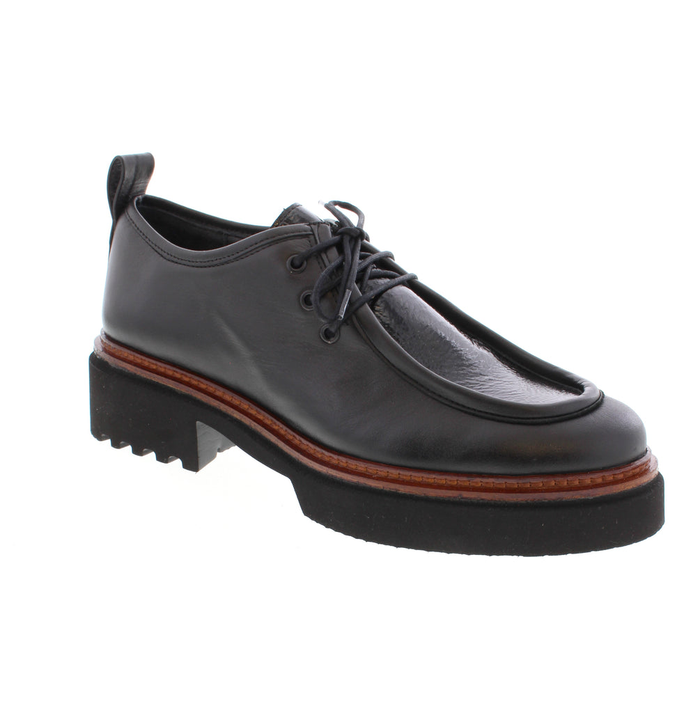 The Unity.In.Diversity Kyoto Kiss in Black combines timeless elegance with everyday versatility. This sophisticated shoe features a premium leather upper, lining, and footbed paired with a supportive foam midsole and durable rubber outsole. Designed for the modern professional, the Kyoto Kiss transitions seamlessly from the office to casual settings. The almond toe and block heel create a flattering silhouette, while the lace-up entry ensures a secure, customizable fit.