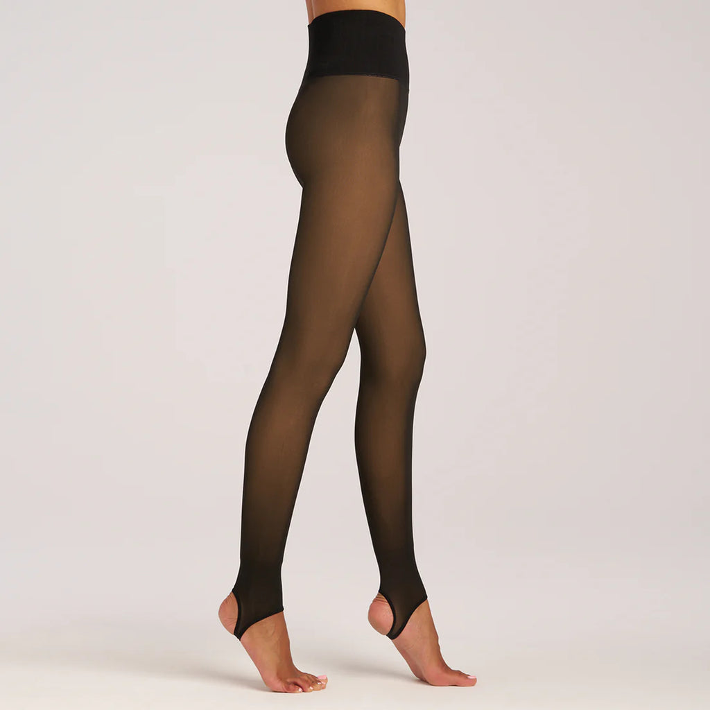 The Lemon Faux Translucent Fleece Lined Tight is a winter wardrobe essential for anyone who loves the look of sheer tights but hates feeling cold. The secret to these sleek tights is a soft fleece lining that will keep you warm without sacrificing style. With a high waistband for sculpting and shaping and a stirrup foot for versatility, these tights are a no-brainer for any winter outfit.