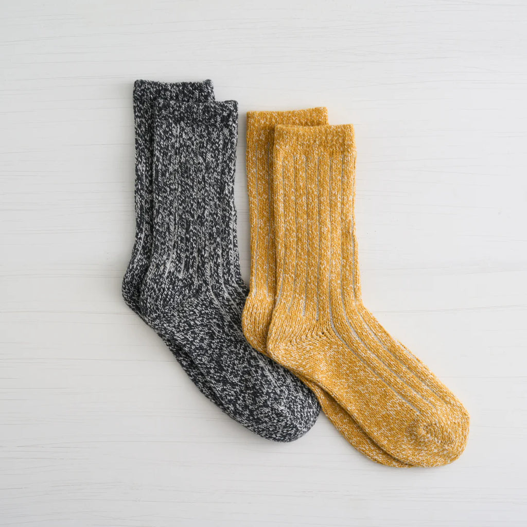 Stay stylishly warm this winter with our Lemon Ribbed Boyfriend Crew socks. Made for ultimate comfort and versatility, these socks will be your go-to accessory for the colder months. With two pairs to mix and match, you'll never have to sacrifice fashion for warmth.