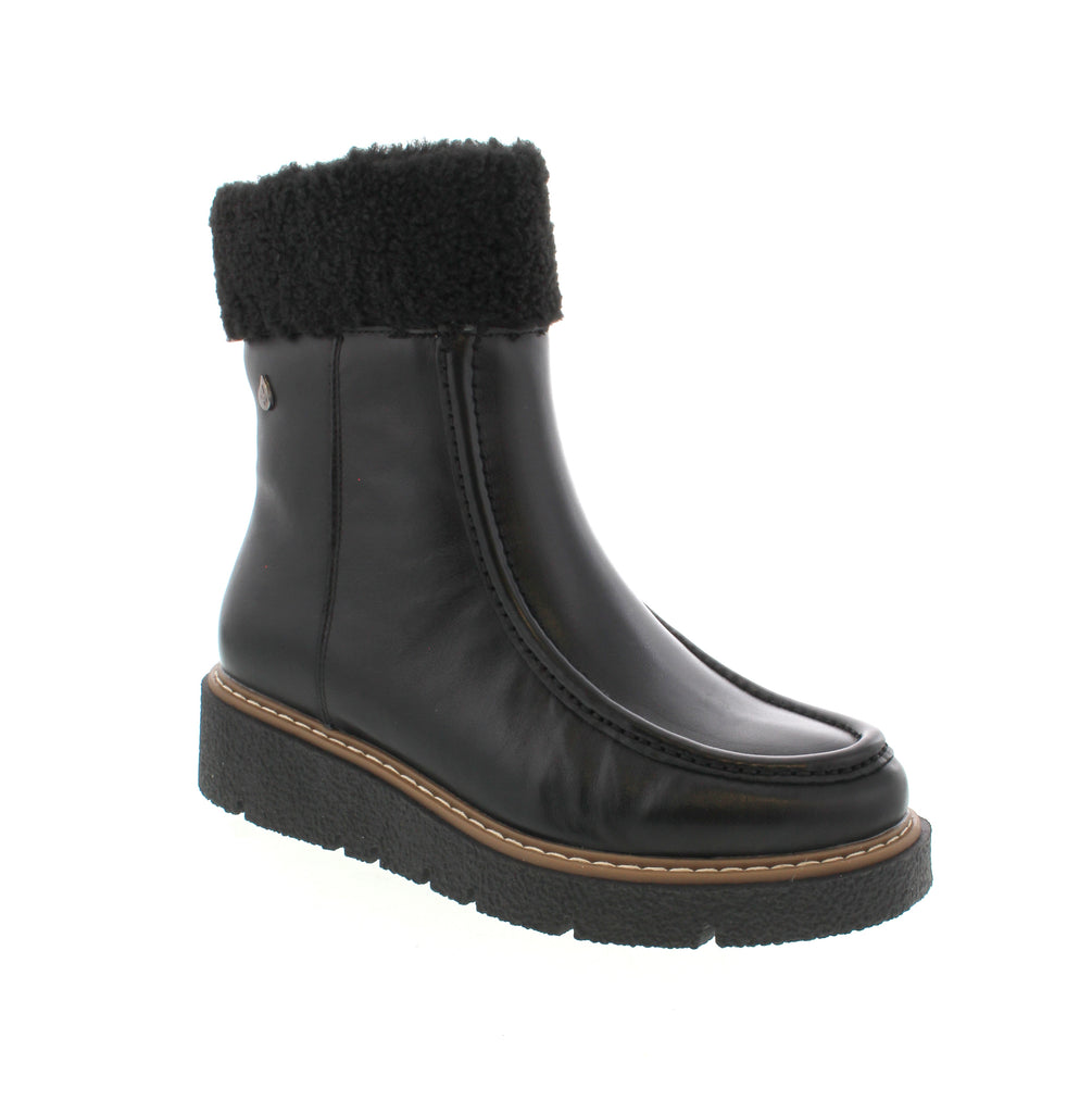 The Aqua Flex Layla in Black Smooth Leather combines style and function with a waterproof upper to keep feet dry in wet conditions. Its faux fur collar adds warmth and a touch of luxury, while the side zip offers easy on-and-off convenience. The platform heel provides added height without compromising comfort, making these boots a versatile choice for both urban and outdoor wear.