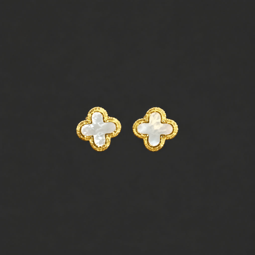 The Hackney Nine Layla - Vintage inspired clover shaped stud earrings crafted with natural shell and infused 18 karat gold metal borders. Hypoallergenic design free from nickel, lead, zinc, and cadmium, making them perfect for sensitive skin. These tarnish-free, waterproof earrings maintain their lustrous finish through daily wear, offering timeless elegance with modern durability.