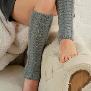 Elevate your outfit with the Lemon Windsor Cable Legwarmer. Made from soft, knitted material, it adds a touch of warmth to any look. Perfect for pairing with skirts or dresses, or layering over tights or leggings when the temperature drops. Stay stylish and cozy in any season.