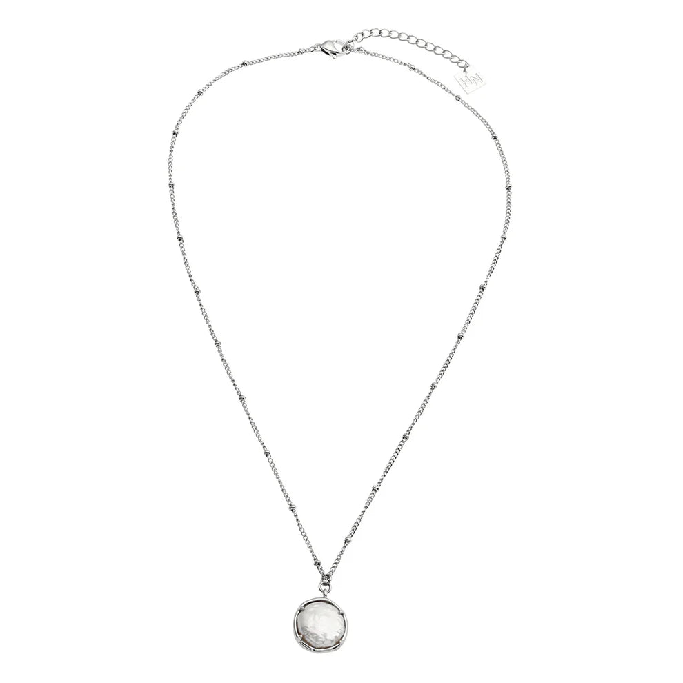 Elevate your jewelry game with the Hackney Nine Lerati necklace. Its timeless design, featuring a beaded chain and freshwater pearl pendant, exudes elegance and simplicity. Crafted from premium recycled metal layered in 18K white gold, it's also non-allergic and free of harmful materials for worry-free wear.