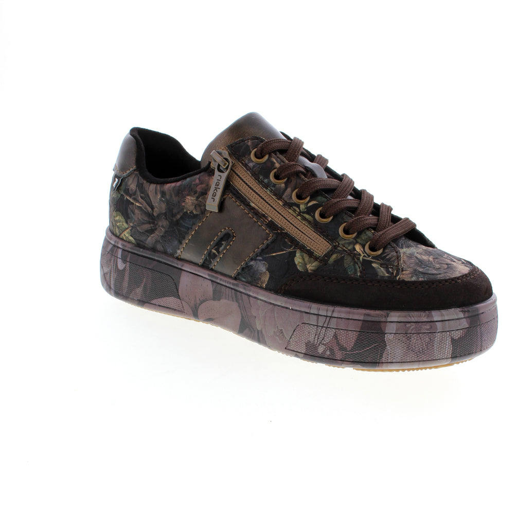 Elevate your everyday style with the Rieker M7711-26 in Black Floral. This casual sneaker combines comfort and sophistication with its leather upper, microfiber lining, and supportive foam midsole.