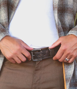 Premium black leather belt with distressing accents.