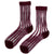 Elegant and unique, these sheer crew socks feature delicate bubble patterns in varying sizes that evoke the sparkle of champagne. The refined design elevates everyday wear with a touch of luxury. Choose from timeless Black, soft Ivory, or rich Merlot to complement your personal style. Hand wash or use a delicate cycle to maintain their beauty. Composition: 43% Polyester, 37% Cotton, 18% Nylon, 2% Spandex.